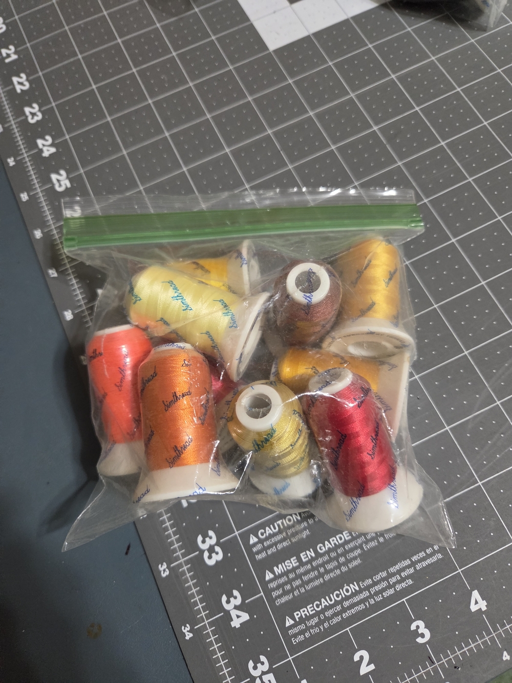 Brother Decorative Thread Spools in Red, Orange, Yellow, Gold, Brown
